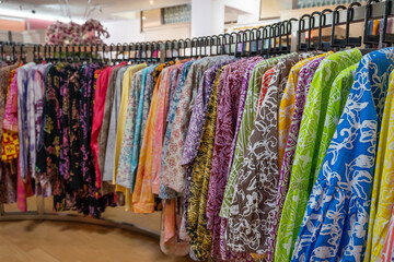 Various types of batik blouse for sale in the retail shop.