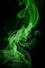 Obraz premium Green smoke waves on a black background.