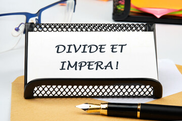 Latin quote Divide et impera meaning Divide and conquer. the best method of governing such a state...