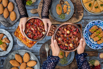 Casserole kebab named belen tava or sac saç kebabı . Roasted meat with pepper and tomato. 