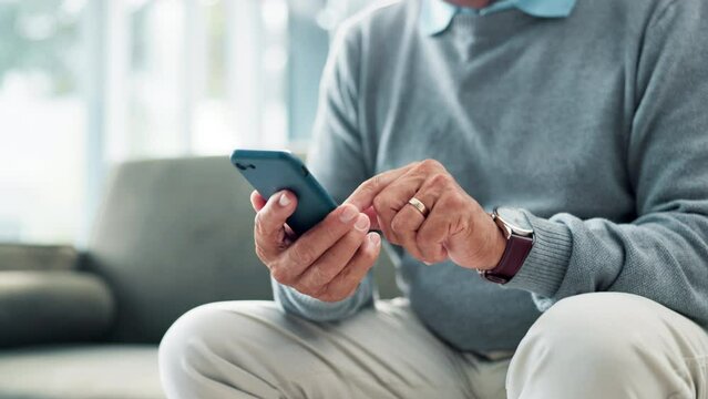 Hand, cellphone and texting on sofa at home for online communication or searching, technology or chatting. Person, fingers and smartphone in living room for internet connection, message or typing