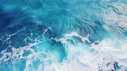 Obraz premium Aerial view capturing the turquoise hues of ocean water, with splashes and foam creating a captivating natural abstract texture.