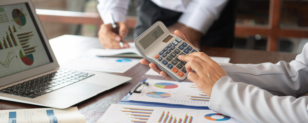 business team or accountant are calculate valuation and appraisal value of property business and...