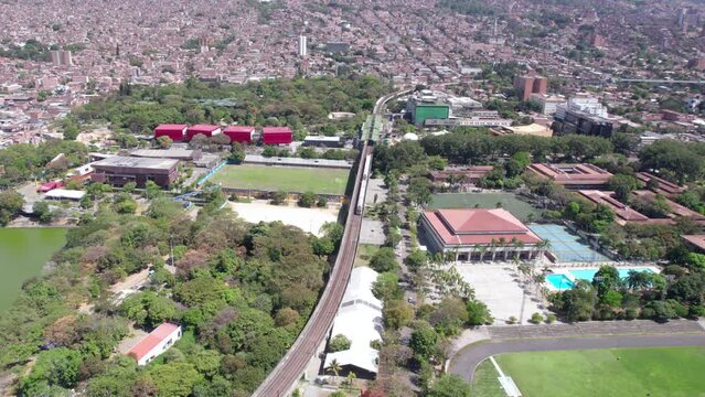 Medellin, Colombia. Aerial View, Parque Explora, Train at Station and University of Antioquia, Drone Shot