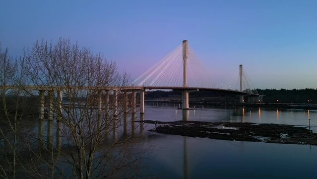 Port Mann Bridge over the Fraser River, Colorful Sunset Sky. Vancouver, British Columbia, Canada.