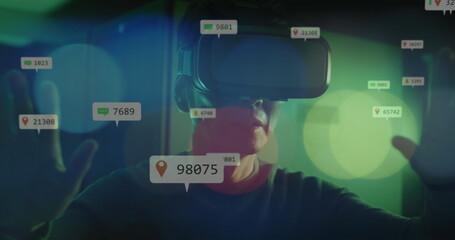 Image of falling icons over african american male server room worker using vr headset