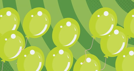 Image of green balloons flying over green background
