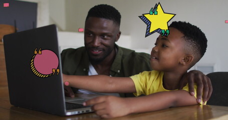 Image of school items over happy african american father and son using laptop