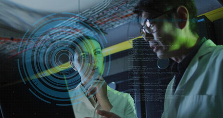 Image of data over diverse male and female it engineers with laptop by computer server