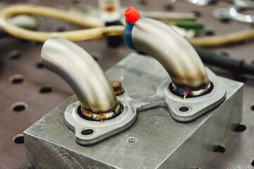 Welded production of external wastegate manifold from stainless steel, exhaust manifolds in a...