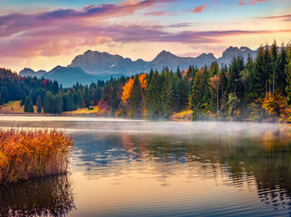Calm morning scene of Wagenbruchsee lake with Kaltwasserkar Spitze mountain range on background....