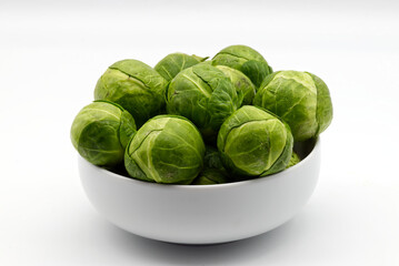 Fresh Brussels sprouts isolated on white background.