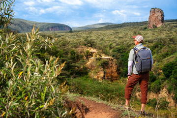 Tourist looking at the scenery of the Hells Gate National Park, Kenya - 756972185