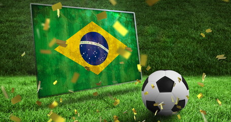 Image of confetti and flag of brazil over football and stadium