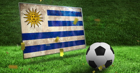 Obraz premium Image of confetti and flag of uruguay over football and stadium