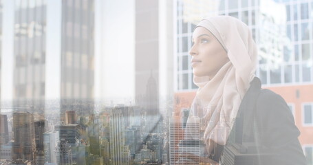 Image of asian woman in hijab with coffee over cityscape