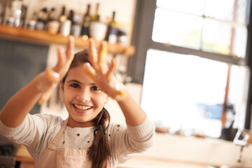 Girl, portrait and hands for baking in kitchen, pastry and happy for food preparation in home....