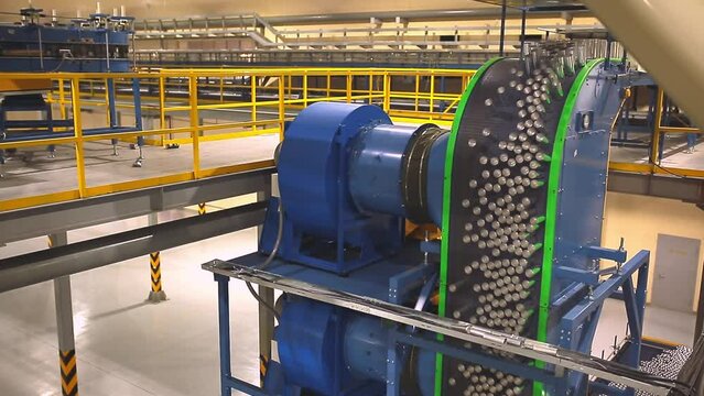 Conveyor line with the production of aluminum cans. Production of aluminum cans for drinks. Plant of high-tech equipment for the food industry.