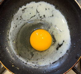 The egg is fried in a frying pan. Close-up - 756981330