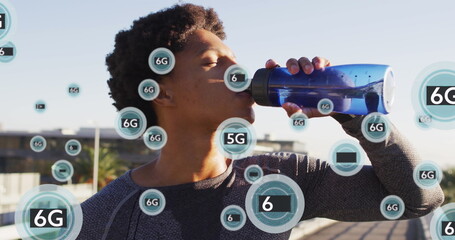 Image of 5g texts over african american man drinking water