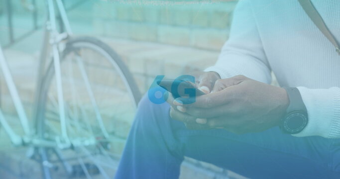 Image of interface displays and 6g text moving over man sitting in street using smartphone - Powered by Adobe