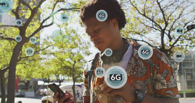 Image of 6g texts over african american man using smartphone