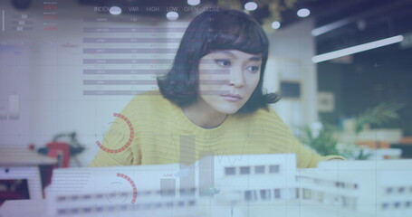 Image of data processing over biracial businesswoman working in architect's office
