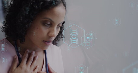 Image of network of medical icons and data processing over biracial female doctor