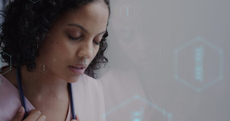 Image of network of medical icons and data processing over biracial female doctor