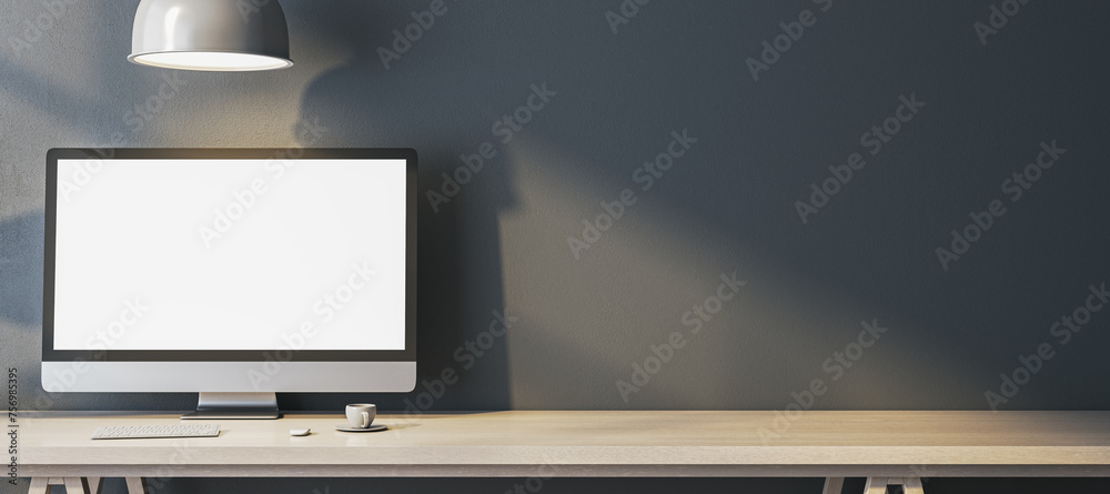 Poster wide home office interior with empty white computer monitor on designer desktop. concrete wall backg
