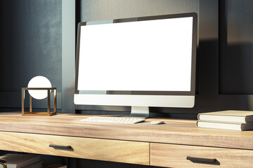 Modern computer screen on a wooden desk with books and minimalist decor. Elegant workspace concept. 3D Rendering
