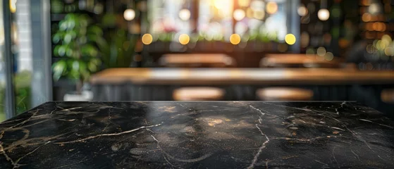 Foto op Canvas Blurred cafe interior background with vintage filter on empty black marble table ideal for product display © The Big L
