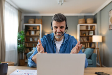 Friendly operator man agent with headsets. business man wearing microphone headset working in the...