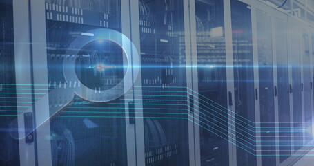 Image of a magnifying glass icons over an empty server room