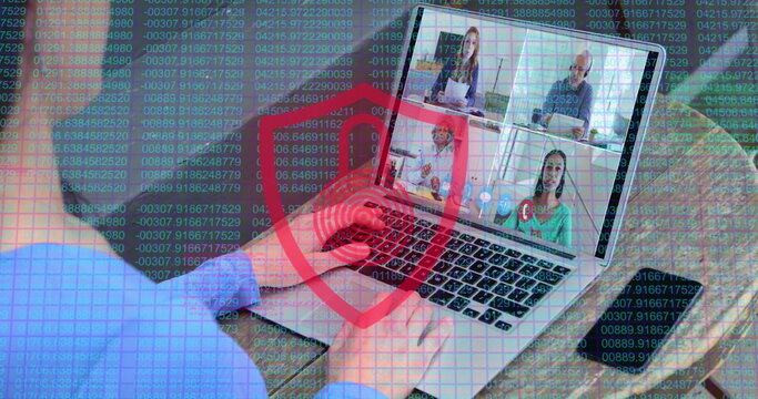 Laptop screen displays a virtual meeting with four participants