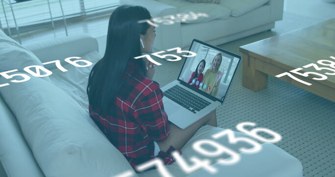 Young biracial woman in a video call with a child and a woman - Powered by Adobe
