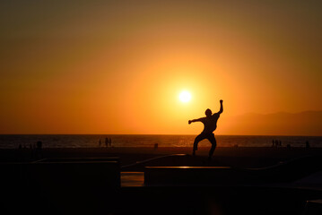 Silhouette of a Skateboarder in Venice Beach at Sunset - Los Angeles, California