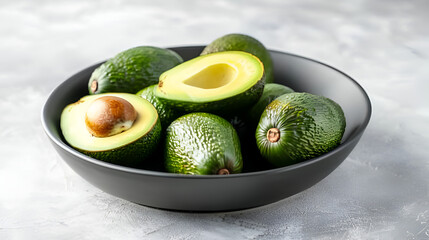 Avocado Harvest in a Bowl on White Background, Fresh Green Avocado Fruits Ready for Harvesting, Ripe Organic Avocados in Ceramic Bowl, Healthy Eating and Nutrition Concept, Generative AI

