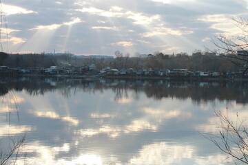 
Beautiful sunset. The rays of the sun break through the clouds.