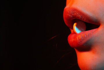 Woman taking pills, closeup. Sick ill woman holding antidepressant painkiller antibiotic pill. Take medicine. Female tongue with tablet pills. Pain and health. Lips holding pill in mouth. - obrazy, fototapety, plakaty