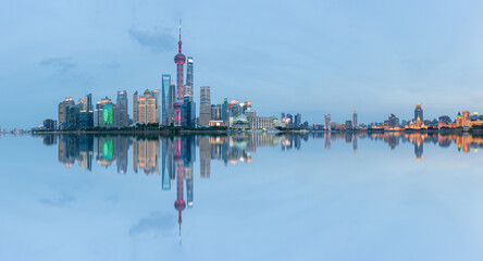 Panoramic skyline of Shanghai and Huangpu river at night