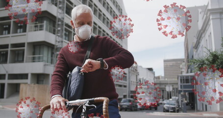 Image of covid 19 cells over senior man wearing face mask