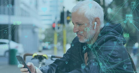 Image of social media icons and network of connections over senior man using smartphone