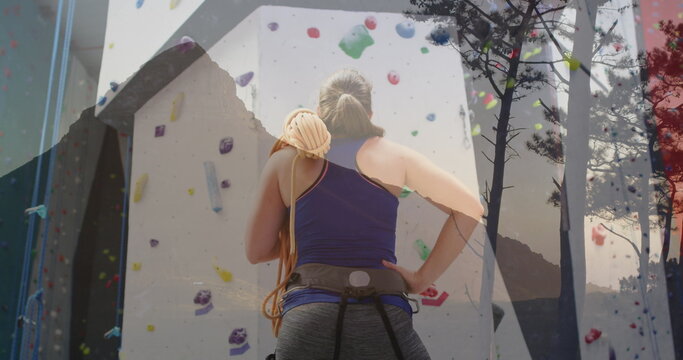 Image of data processing over caucasian woman by climbing wall - Powered by Adobe