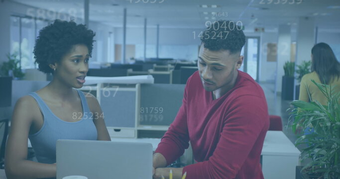 Image of numbers and data processing over diverse business people in office - Powered by Adobe