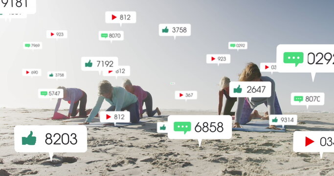 Image of social media notifications, over women doing yoga on beach - Powered by Adobe