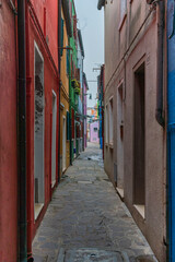 Fototapeta premium Burano colored houses during Winter time with fog background