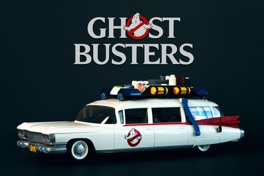 Playmobil car from the movie Ghostbusters with the Ghostbusters logo above. Illustrative editorial