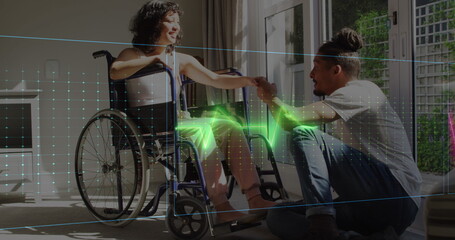 Fototapeta na wymiar Image of neon heart rate over happy biracial couple, woman on wheelchair
