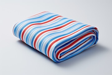 A folded beach towel made of striped material presented on a white background separate from other objects